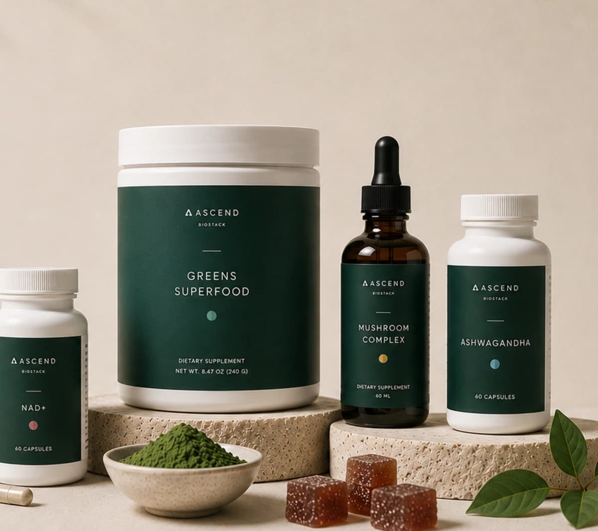 Ascend BioStack supplements arranged on warm stone plinths